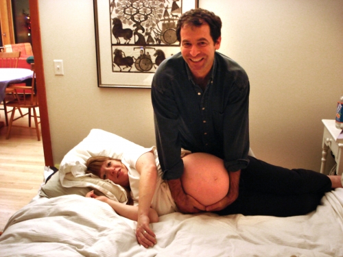 Josh Gamson ’85 holds Tamar Datan ’85's pregnant belly